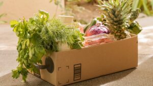 brown box with green leafy vegetables